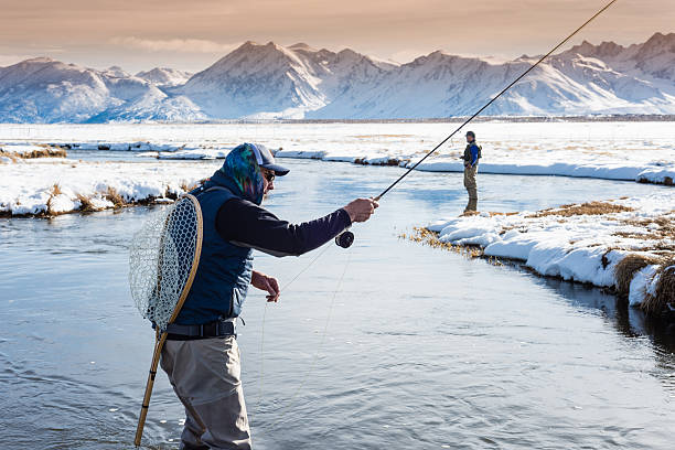istock Two Fly Fisherman In The River During Winter 509481320