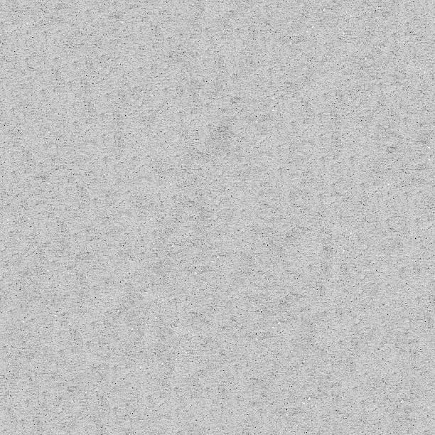Seamless raw rough grunge dotted gray paper wall texture background