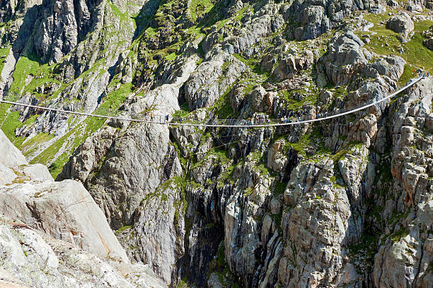 istock Trift Bridge, pedestrian-only suspension bridge in Alps. Svitzerland 509481906