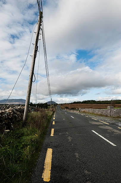 Empty and lonely road in Connemara, Galway, Ireland stock photo