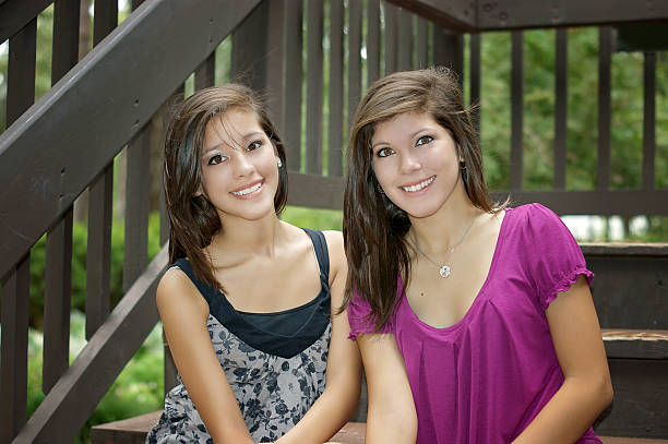 istock two girls posing in a park 509484520