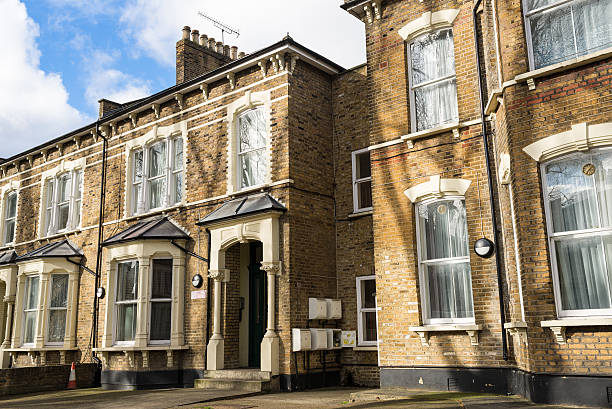 Facade of British Victorian family houses Facade of British Victorian family houses house uk row house london england stock pictures, royalty-free photos & images