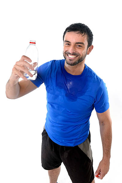 istock young attractive and athletic sport man drinking water 509487795