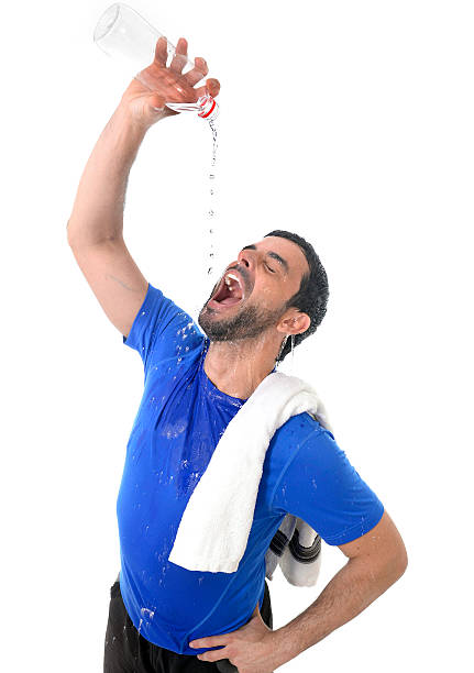 young handsome and athletic sport man drinking water