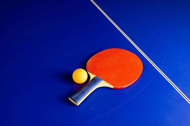 istock Table Tennis Ball and a Racket on a Blue Table 509487996
