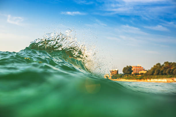 istock Beautiful colorful ocean wave crashing closing near sand beach 509488535