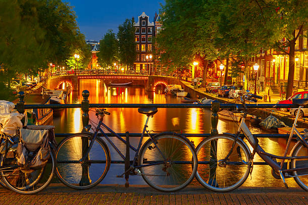 istock Night  illumination of Amsterdam canal and bridge 509488861