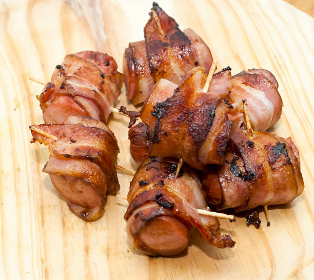 Deep fried sausages rolled in bacon