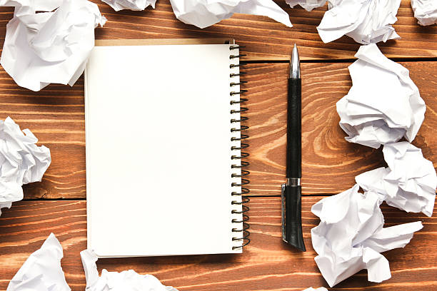 istock Office desk table with supplies and crumpled paper. Top view 509489606
