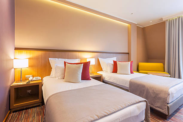 Twin hotel room interior Twin hotel room interior twin bed stock pictures, royalty-free photos & images