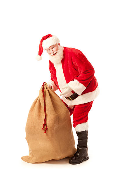 istock Santa Claus Lifting Large Gift Bag on White Background 509490583