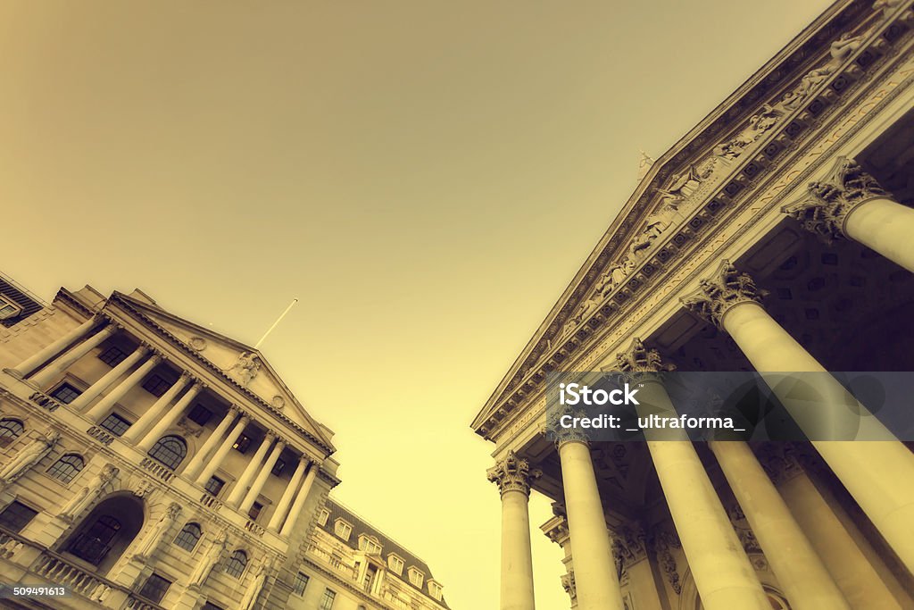 Financial institutions Low angle view of the main facades of The Bank of England and London Stock Exchange in the City of London. Architectural Column Stock Photo