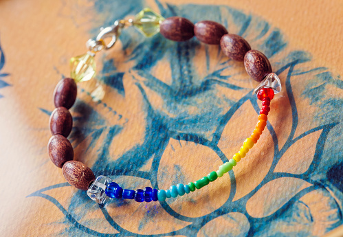 Yoga bracelet with rainbow colored beads