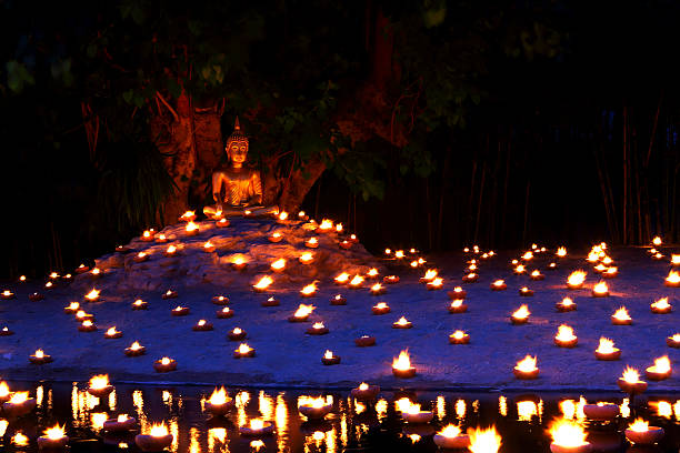 istock Buddhist monk fire candles to the Buddha 509492351