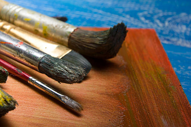 istock Painting tools colour palette and Artist paint brushes on abstract 509492498