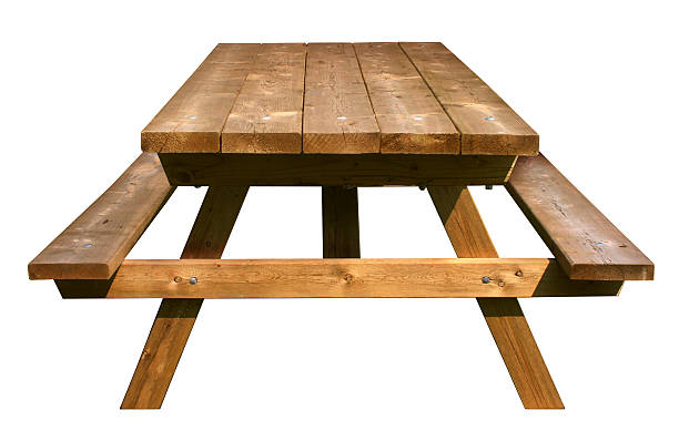 Picnic Table Front View Picnic Table front view made of weathered wood on an isolated white background as a symbol of summer and barbecue leisure activity. picnic table stock pictures, royalty-free photos & images