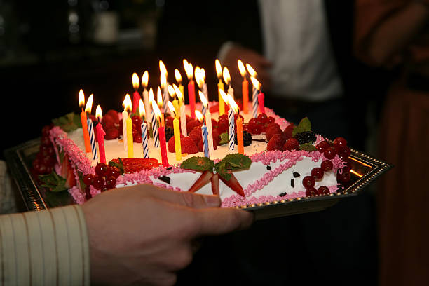 istock cake with candles and decorated with berries 509493452