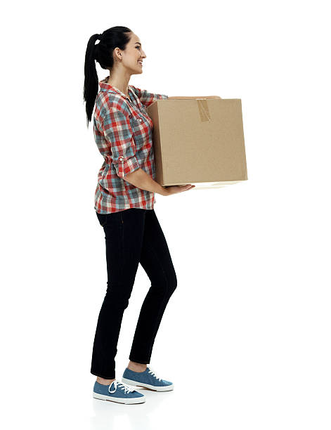 istock Smiling casual woman holding box 509496704