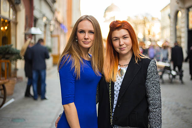 Young beautiful women Young beautiful women on the street at sunny day teenager couple child blond hair stock pictures, royalty-free photos & images