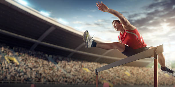 masculino atleta de desporto de competição corrida de barreiras - hurdling hurdle running track event imagens e fotografias de stock