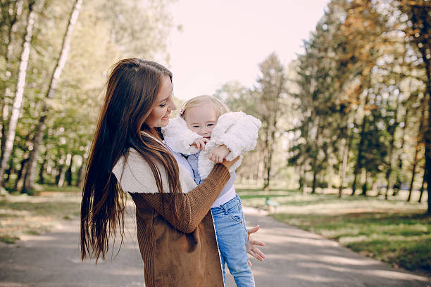 istock young family walking in the park 509498736