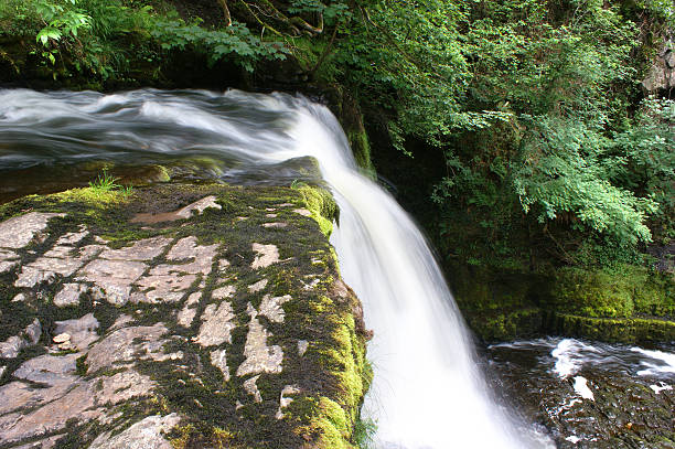 Sgwd Clun-Gwyn Waterfall in the Brecon Beacons National Park, South Wales. I captured this picture using a longish exposure, so as to slightly blur the water, thus giving a feel of fluid mobility.