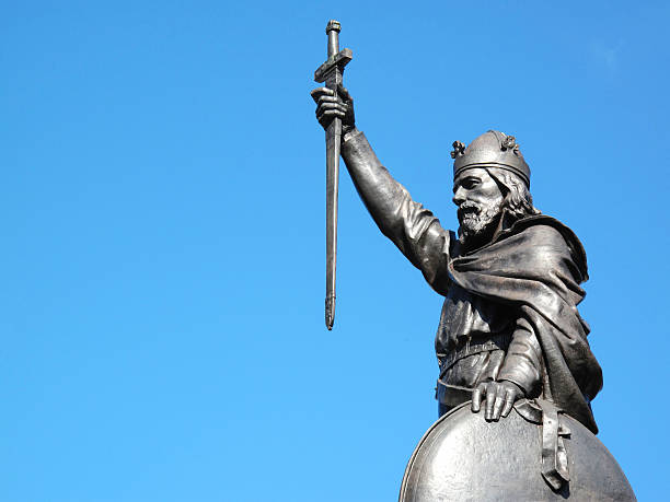 Alfred The Great King Alfred The Great's statue designed by Hamo Thornycroft and erected in 1899 stands at the eastern  end of the Broadway in Winchester, Hampshire, England with copy space anglo saxon photos stock pictures, royalty-free photos & images