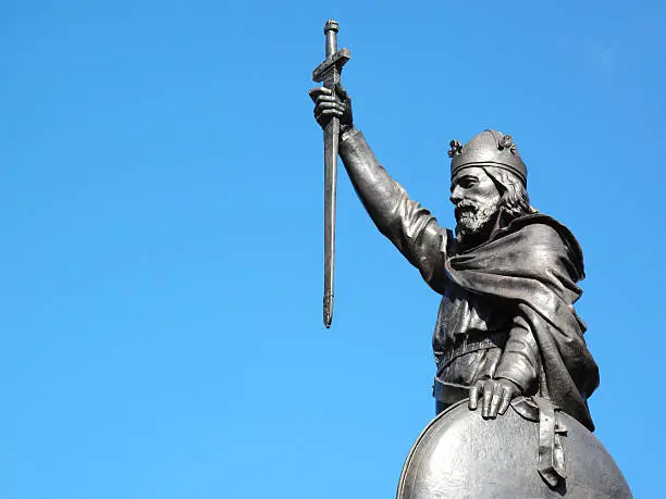 King Alfred The Great's statue designed by Hamo Thornycroft and erected in 1899 stands at the eastern  end of the Broadway in Winchester, Hampshire, England with copy space