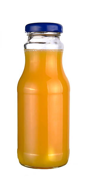 istock Orange juice in a little glass bottle 509516295