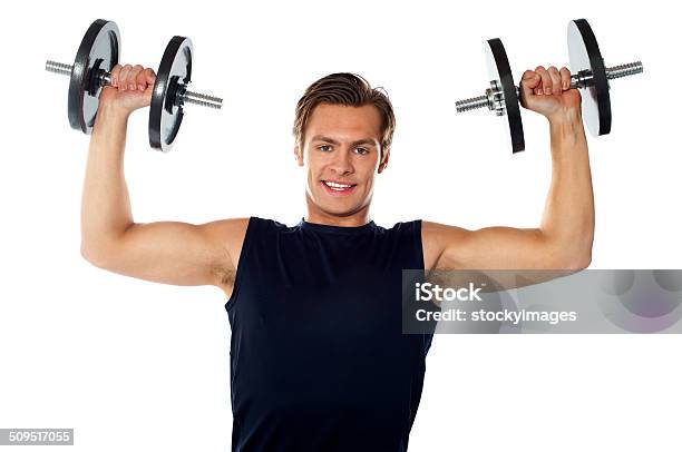 Caucasian Athlete Exercising In Sporty Outfits Stock Photo - Download Image Now - Adults Only, Anaerobic Exercise, Athlete