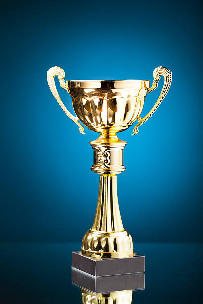 istock gold cup trophy on blue background 509530226