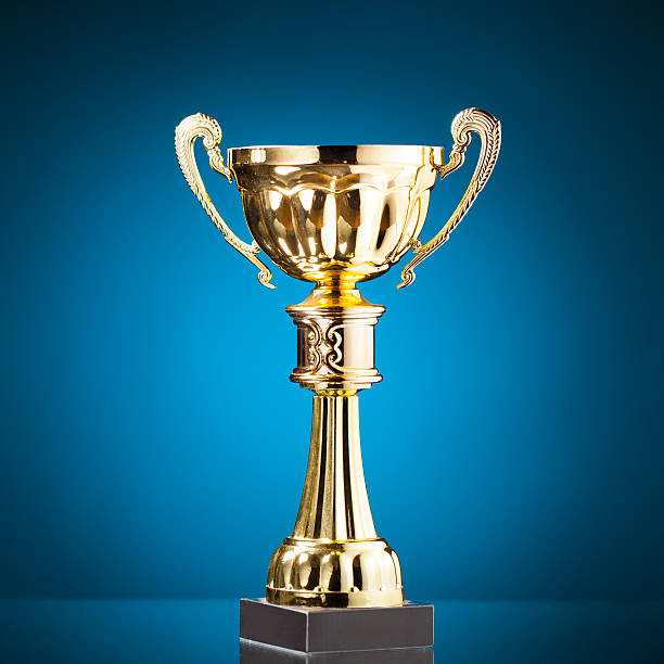 istock gold cup trophy on blue background 509530250