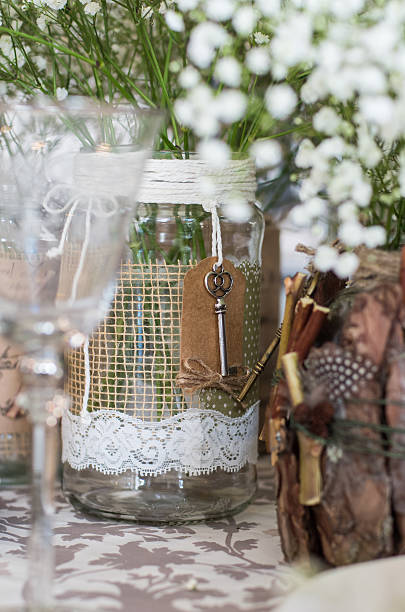 istock Wedding decoration for table, white flowers in the glass jar 509530954