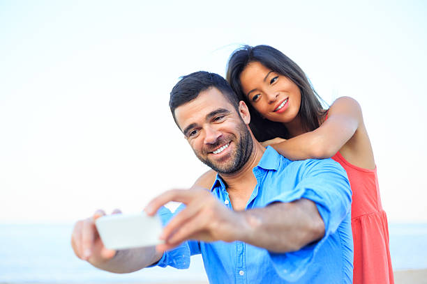 istock Young couple making selfie on the beach 509532448