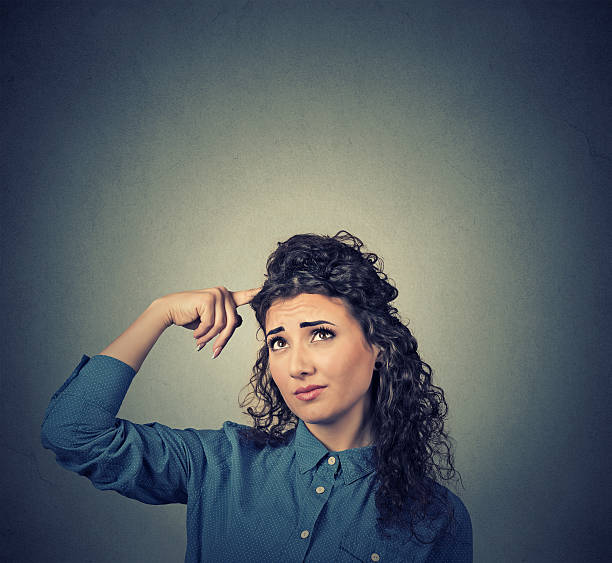 istock confused skeptical woman thinking looking up 509532466