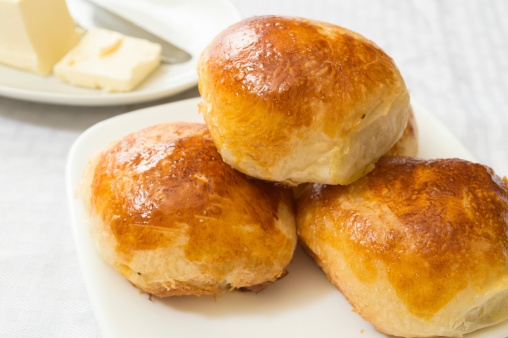 fresh hot dinner rolls out of oven served with butter