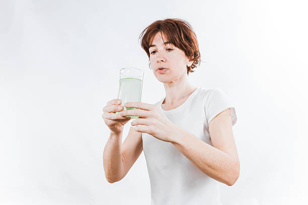 istock Person with water glass 509534418