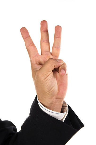 istock hand and businessman showing three fingers 509534459