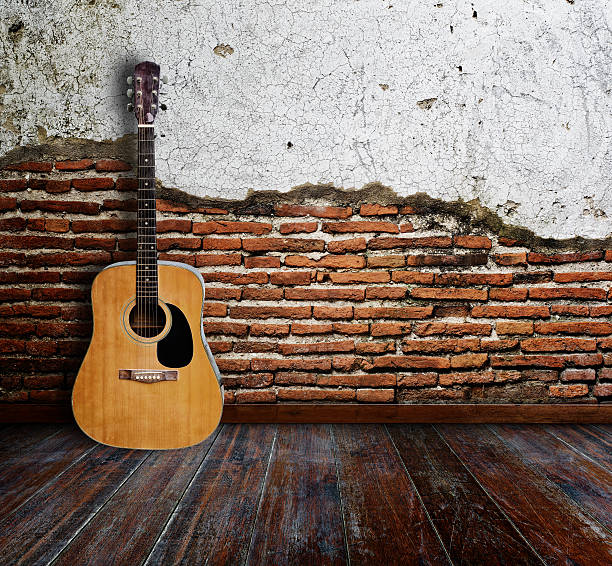 Guitar room Guitar in grunge room. acoustic guitar stock pictures, royalty-free photos & images