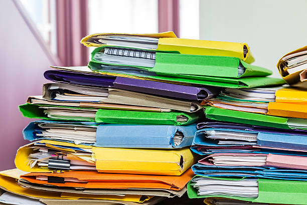 istock Messy pile of paperwork in home office 509536296