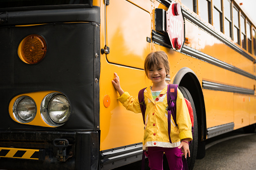 Little girls first day of school and first day on a school bus