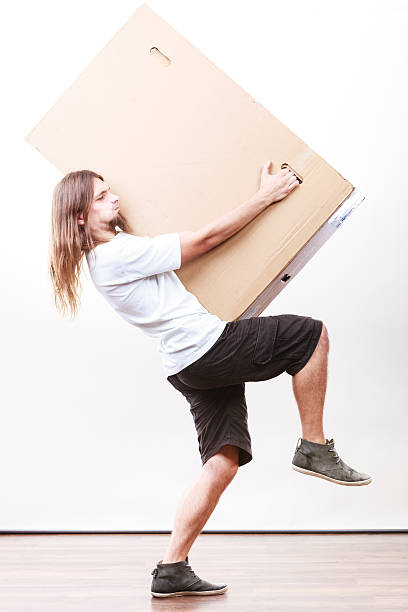 istock Delivery man holding a paper box. 509537516