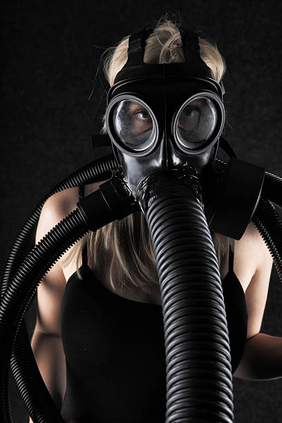 istock Blonde Wearing A Gas Mask 509537589