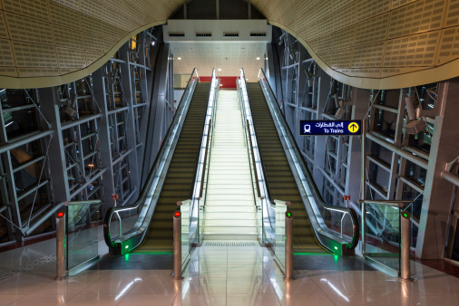 Dubai, United Arab Emirates - March 27, 2014: Escalators inside Jumeirah Lakes Tower metro station.