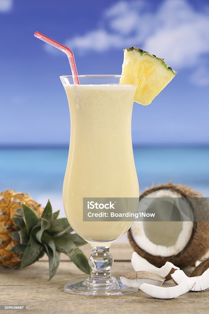 Pina Colada cocktail with fruits on the beach Cold Pina Colada cocktail with fruits on the beach while on vacation Beach Stock Photo