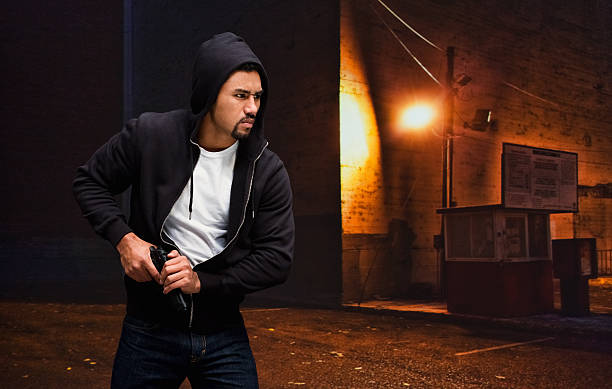 istock Gangster taking his gun out 509539166