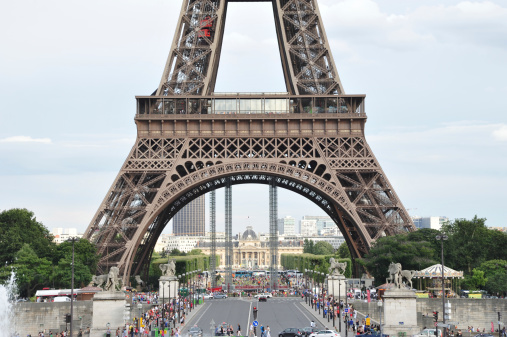 Paris, France - August 13, 2012: The Eiffel Tower is viewed from the Place of the Trocadero. The Trocadero or The palace of Chaillot was created for the Exposition Internationale of 1937 by Leon Azema, Jacques Carlu and Louis Hippolyte Boileau. Tourists are sightseeing on the place.
