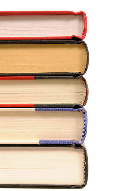 istock Small stack of hardback books isolated on white background. 509541082