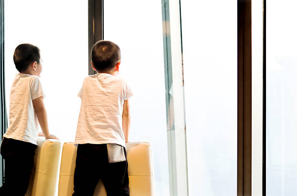 istock Little asian boy standing on chair 509545620