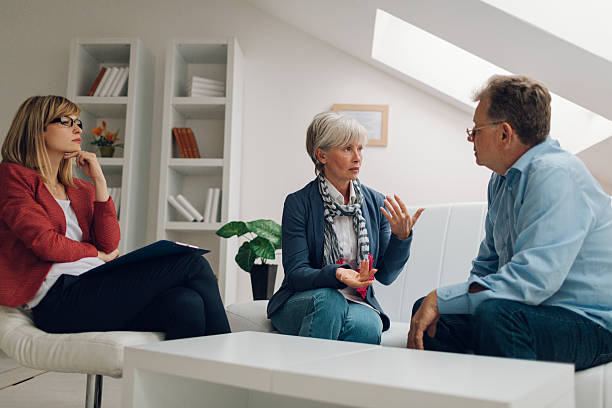 istock Mature Couple Talking to Counselor 509545900